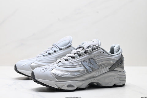 New Balance 1000 series running shoes, low-top, retro dad style, casual sportswear.