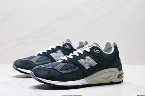 New Balance NB 990 series athletic shoes, breathable mesh cushioning, casual running shoes.
