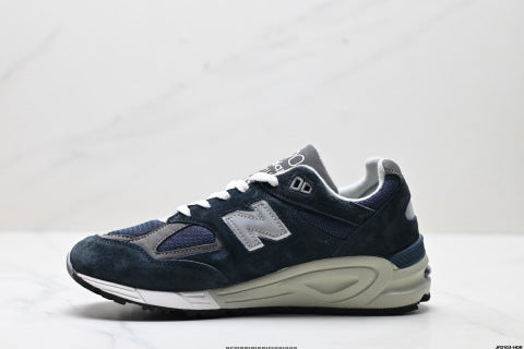 New Balance NB 990 series athletic shoes, breathable mesh cushioning, casual running shoes.