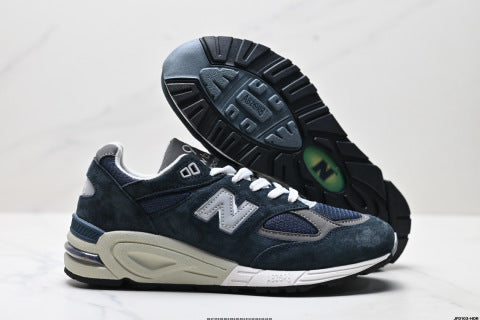 New Balance NB 990 series athletic shoes, breathable mesh cushioning, casual running shoes.