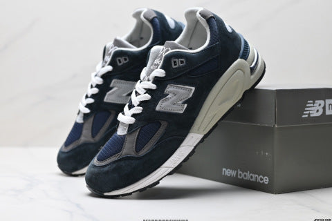 New Balance NB 990 series athletic shoes, breathable mesh cushioning, casual running shoes.
