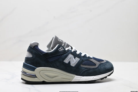 New Balance NB 990 series athletic shoes, breathable mesh cushioning, casual running shoes.