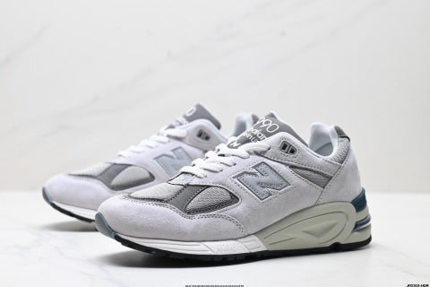 New Balance NB 990 series running shoes, athletic shoes, breathable mesh cushioning, casual wear.