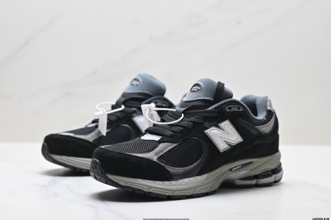 New Balance 2002R athletic shoes, men's and women's, breathable and cushioned, outdoor style.