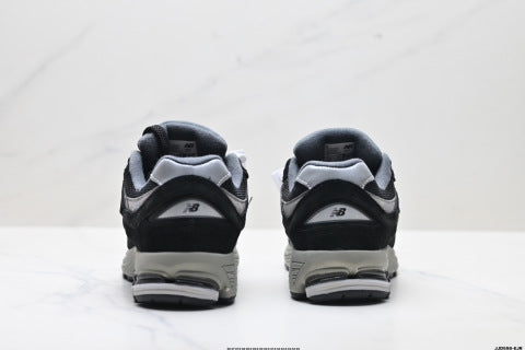 New Balance 2002R athletic shoes, men's and women's, breathable and cushioned, outdoor style.