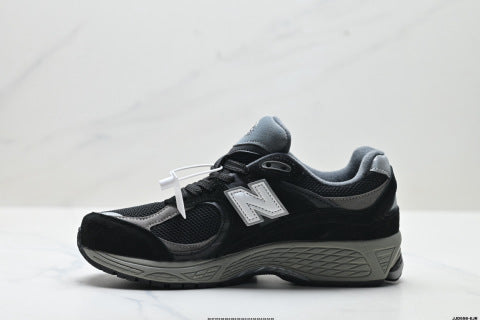 New Balance 2002R athletic shoes, men's and women's, breathable and cushioned, outdoor style.